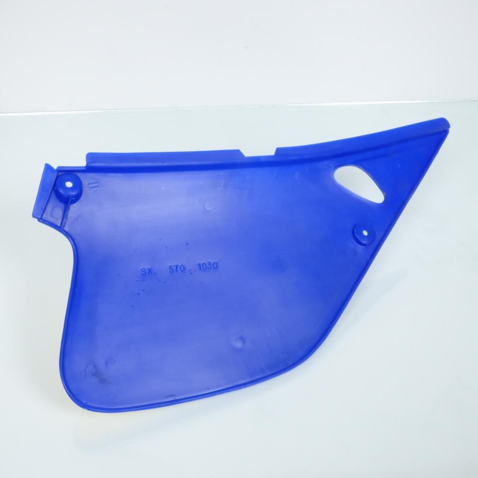 Cache latéral gauche origine pour Moto Rieju 50 RR 1998 à 2004 0/000.570.2180 / 570.1030 bleu Neuf