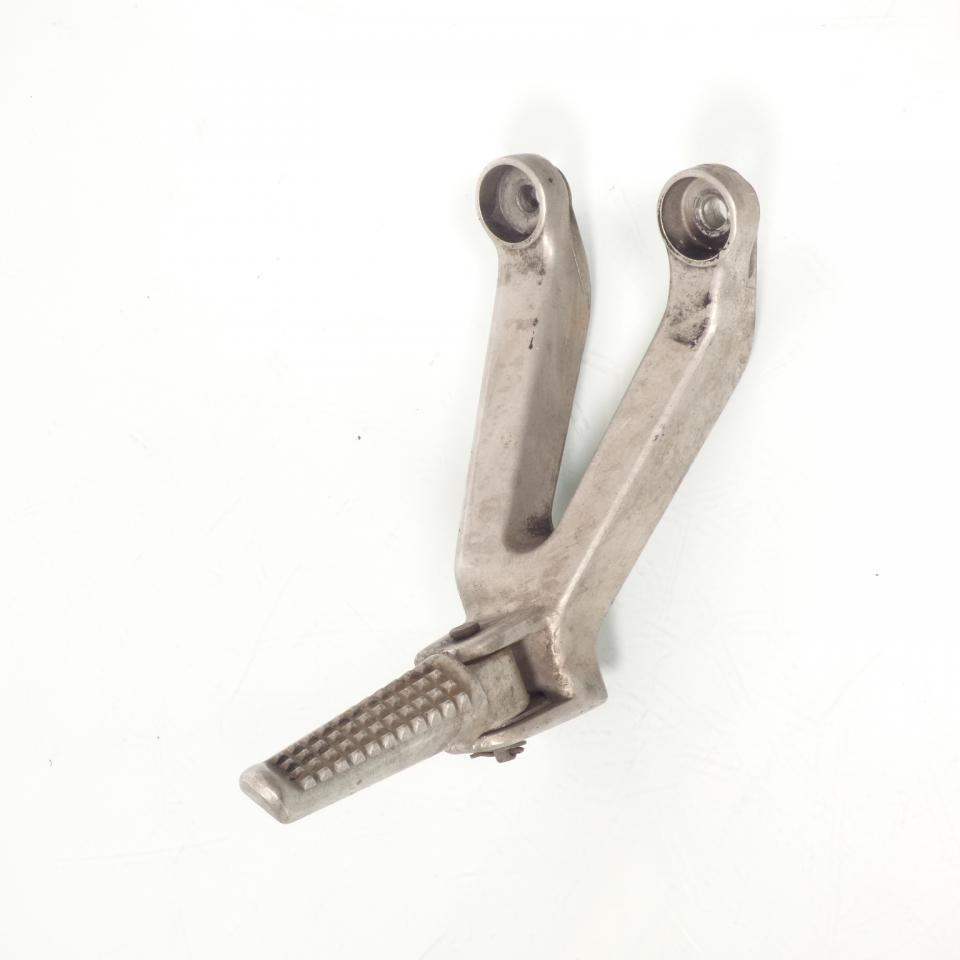 photo piece : Platine de repose pied passager gauche->Honda CBR